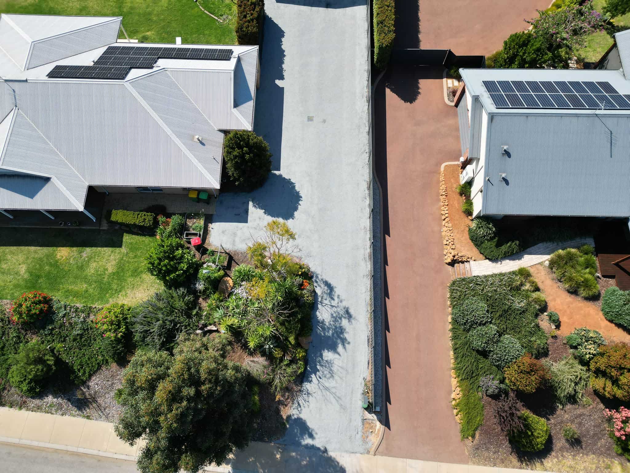 Aerial view of newly paved residential driveways.